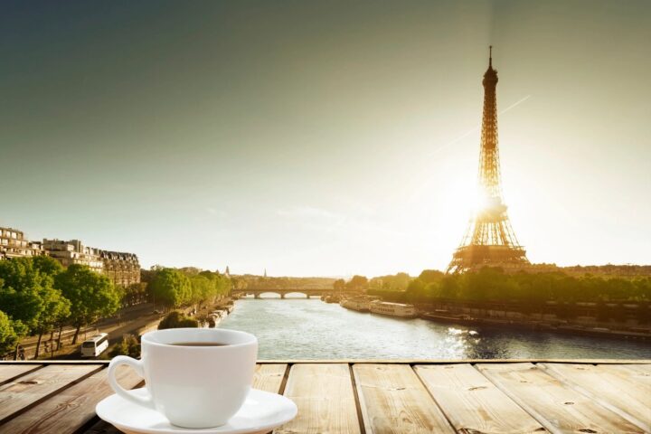 A hot coffee on an outdoor table at sunrise, the kind of dawn patrol moment a Mizu Coffee Mug is used for. Stock photo courtesy of GoDaddy Stock Photos.